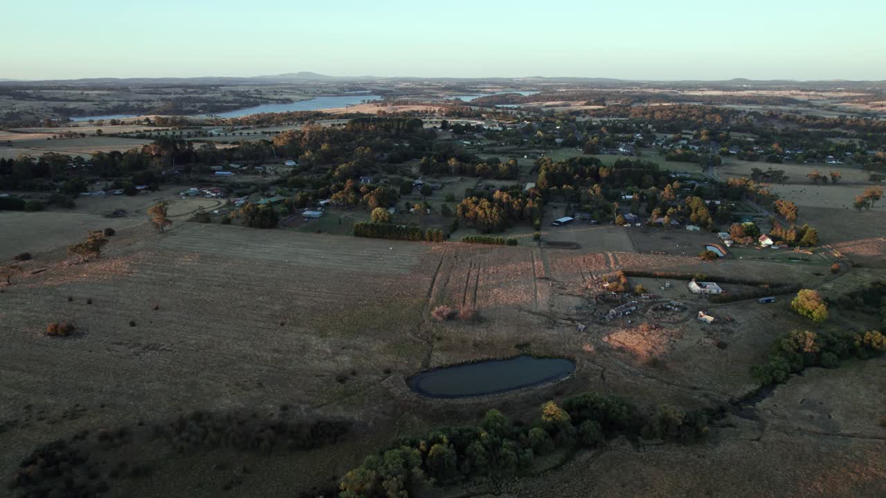 Aerial view of the small township of Tylden with the Upper Coliban Reservoir in the distance, Victoria, Australia. March 2025.