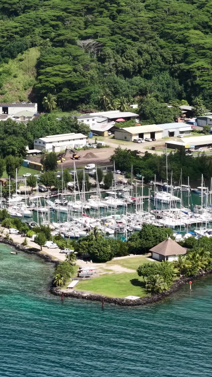 Moorea Island, French Polynesia. Vertical Drone Shot of Sailing Boats in Harbor Marina
