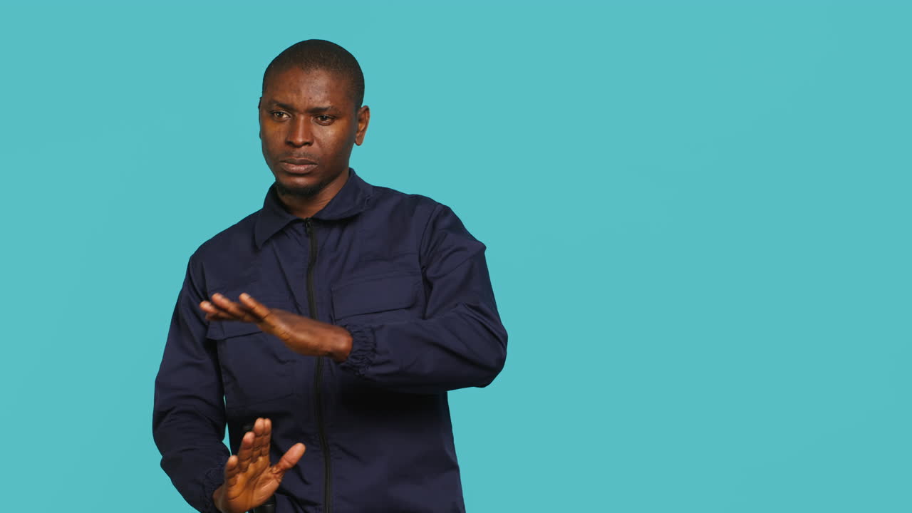 Security guard doing time out sign gesturing, ceasing unwanted access