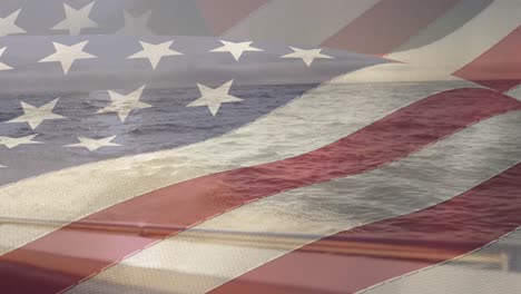 american flag waving against portrait of view of ocean from a boat