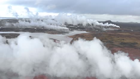 aerial shot of a geothermal power station built on a volcanic hot spring