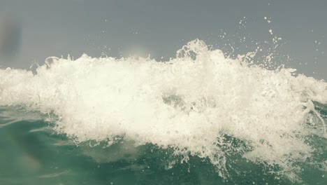 sea wave. woman swims on an inflatable ring in the sea.