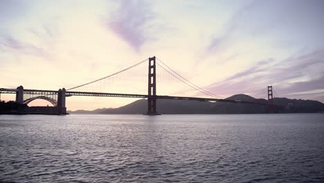 the ocean and the golden gate bridge during sunset