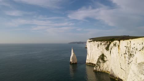 drone flying along cliff and toward stunning stack, old harry rocks on purbeck island, dorset in england