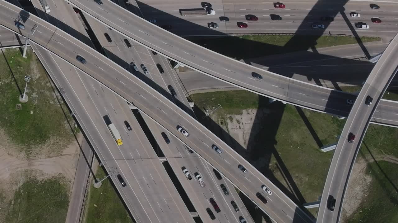 Aerial view of highways in downtown Dallas, Texas with moving cars