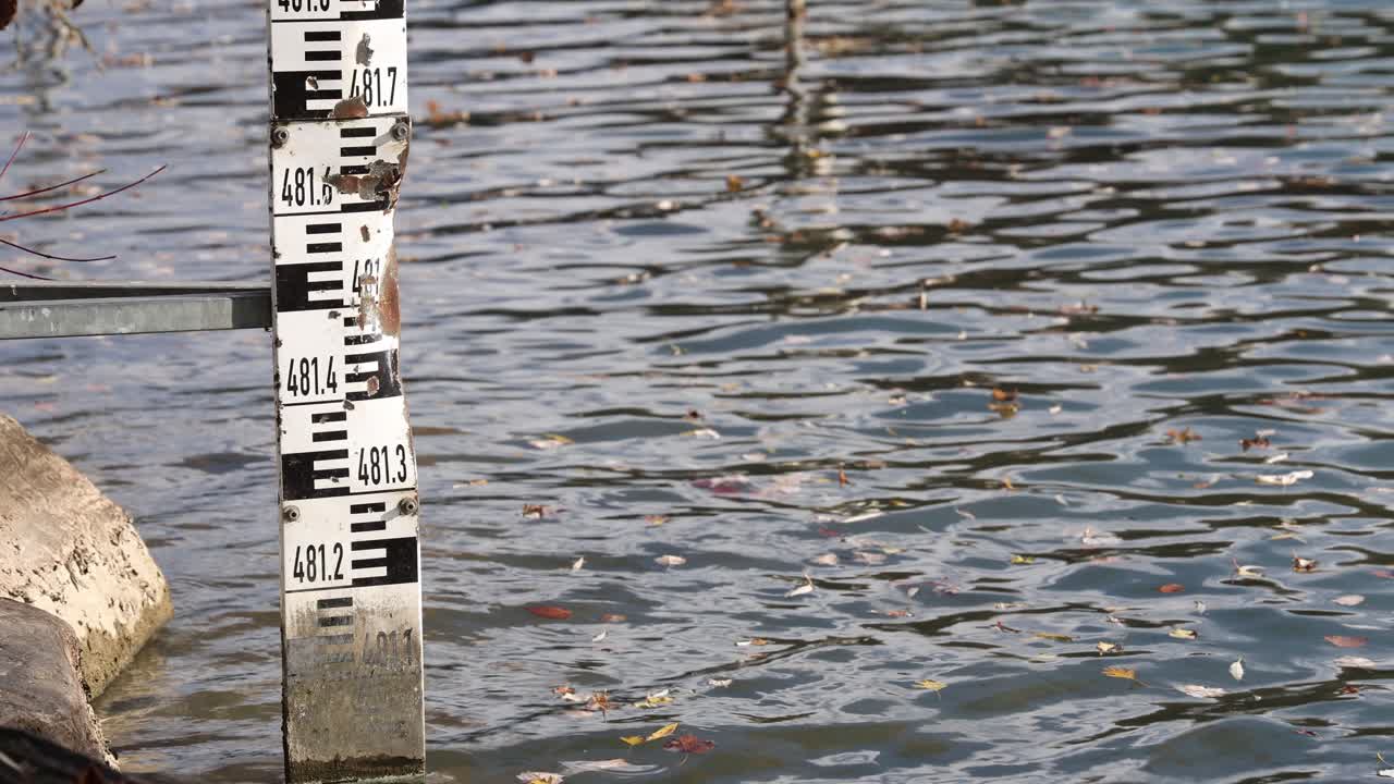 Water level indicator with rust and broken parts, depth scale