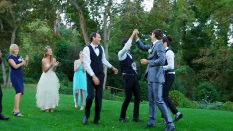 groom and groomsmen enjoying catching garter toss 4k 4k