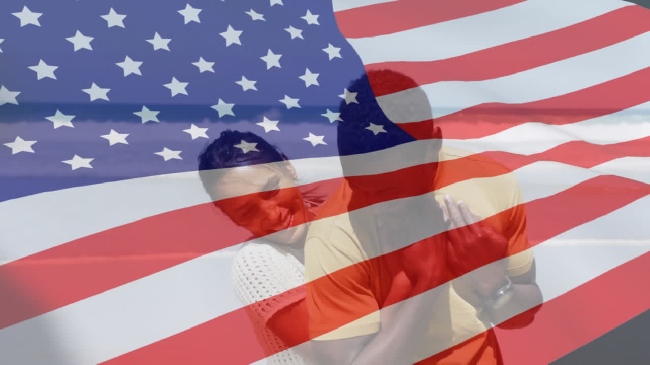 Animation of american flag over african american couple embracing at beach