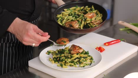 chef preparing chicken pesto pasta