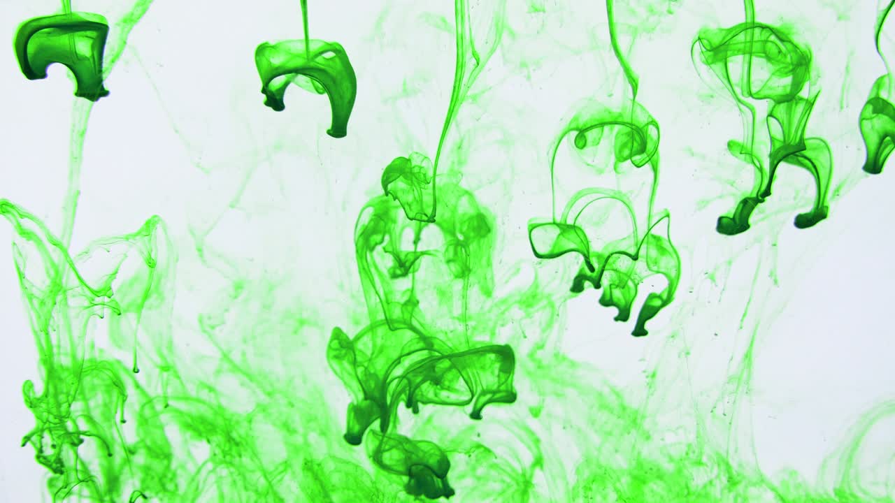 4K footage of colorful ink drops in water, isolated abstract background. Pouring ink in water. Underwater paint mix. Slow psychedelic dye swirls, colored smoke explosion. Splashing, floating liquid