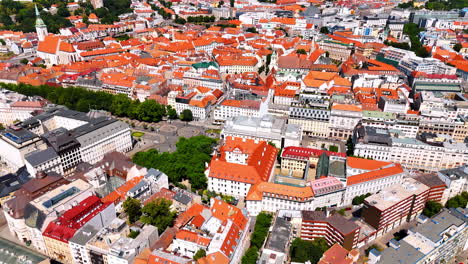 stunning densely built historical part of bratislava, slovakia. sunny scenery of old town with orange roofs from drone