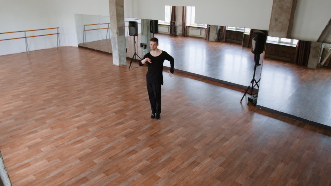 Male Dancer Practicing Contemporary Dance in a Studio