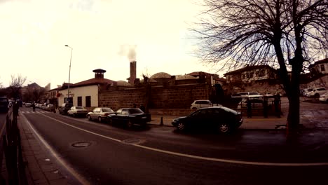 smokes smoke from the turkish bath evening road with cars ankara