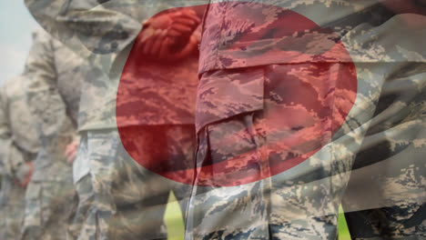 Animation-of-flag-of-japan-waving-over-midsection-of-group-of-soldiers