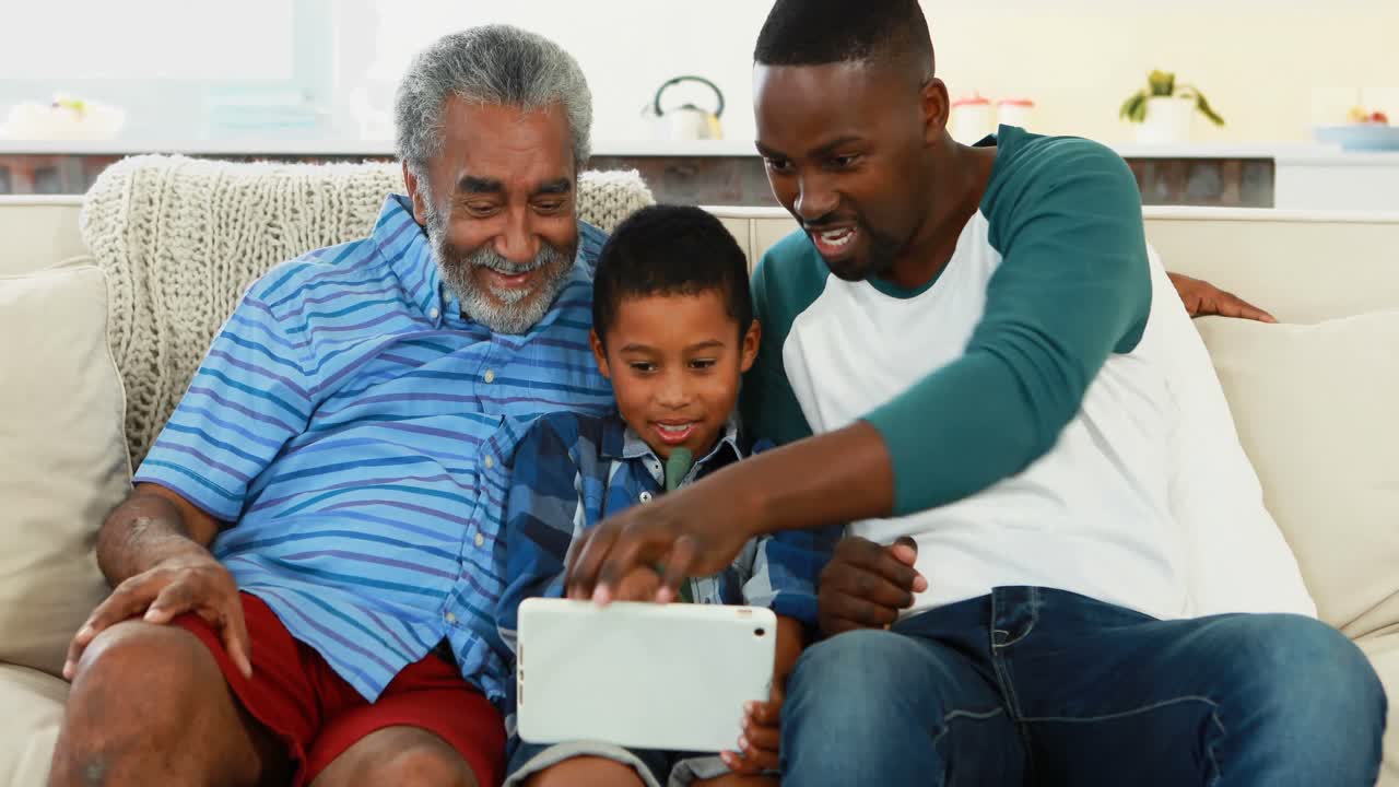 Multi-generation family using digital tablet in living room