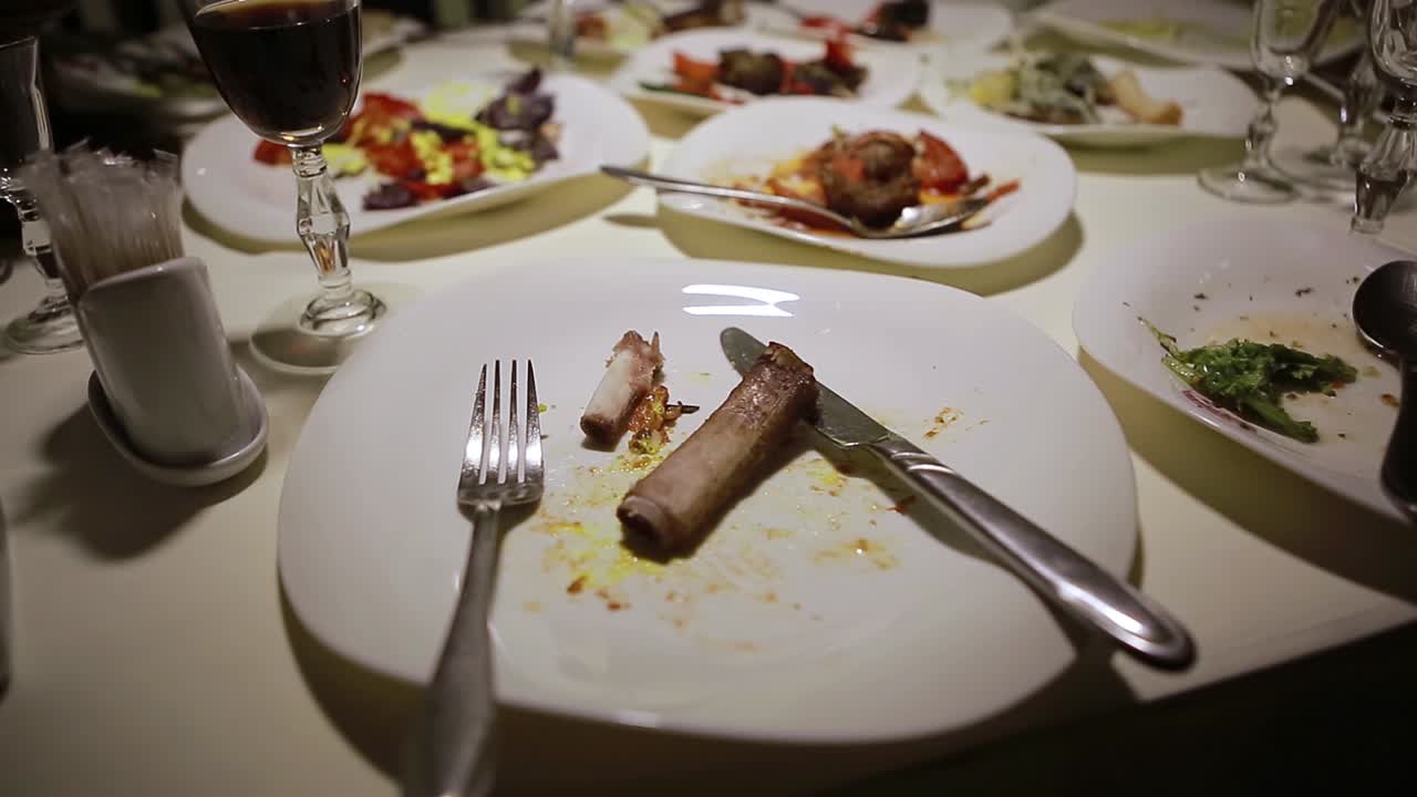 Dirty And Empty Dishes. Dirty dishes on a table in a restaurant