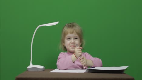 Girl-drawing-at-the-table.-Education-process.-Three-years-old-child.-Chroma-Key