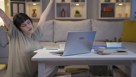 Young-woman-looking-tired-and-exhausted-at-laptop-at-night.