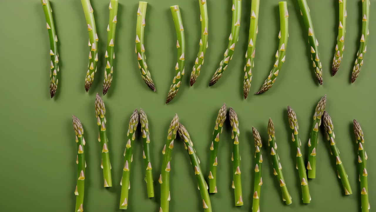Fresh Asparagus Spears on Green Background