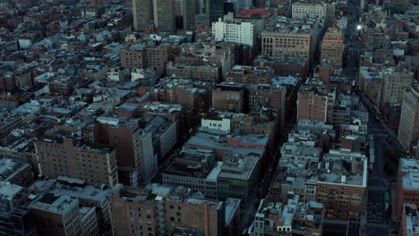 Slide-and-pan-footage-of-Manhattan-bridge-with-heavy-traffic.-High-rise-apartment-building-One-Manhattan-Square-on-waterfront.-Manhattan,-New-York-City,-USA