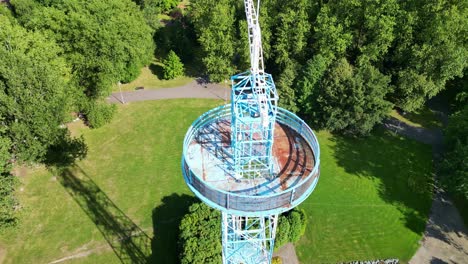 Aerial-Viev-of-Blue-and-White-Parachute-Tower-on-Sunny-Day