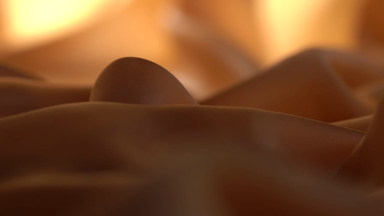 Macro Shot Of Silk Textiles Backlit By Light Before Moving Shadow Hides Lighting.