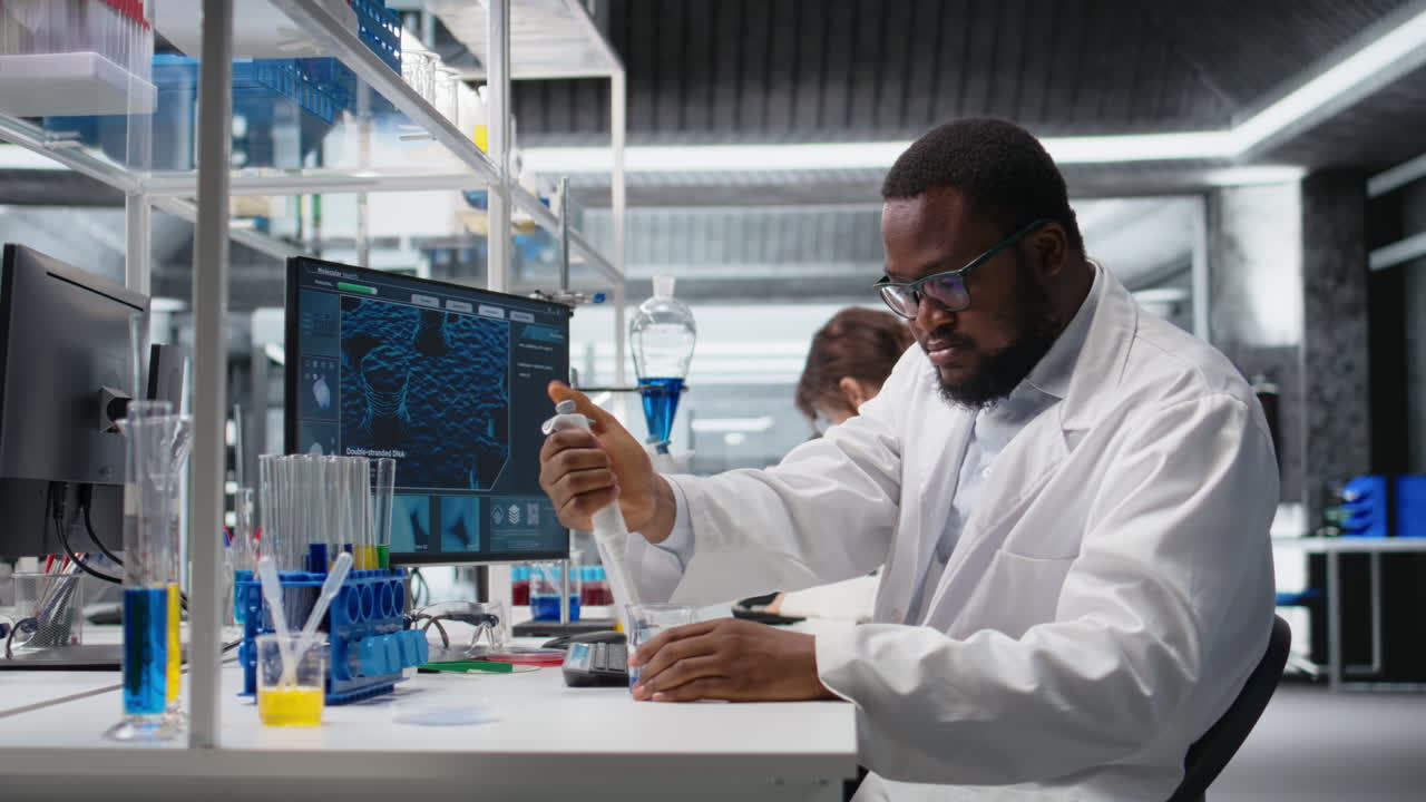 Vertical video Chemist uses pipette to transfer liquid into test tube at laboratory bench