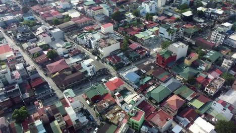 Drone-Shot-of-Makati-Streets-with-cars-and-motorcycles-passing-by