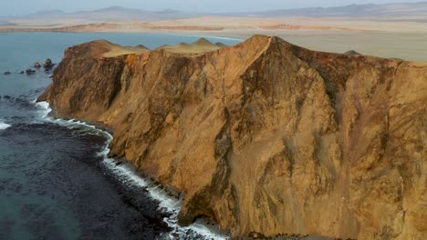 scenic landscape of the ocean cliffs of paracas, peru - aerial view