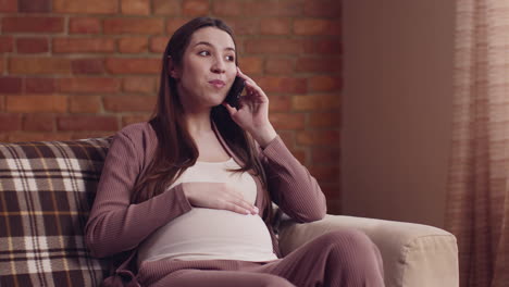 pregnant woman talking on phone