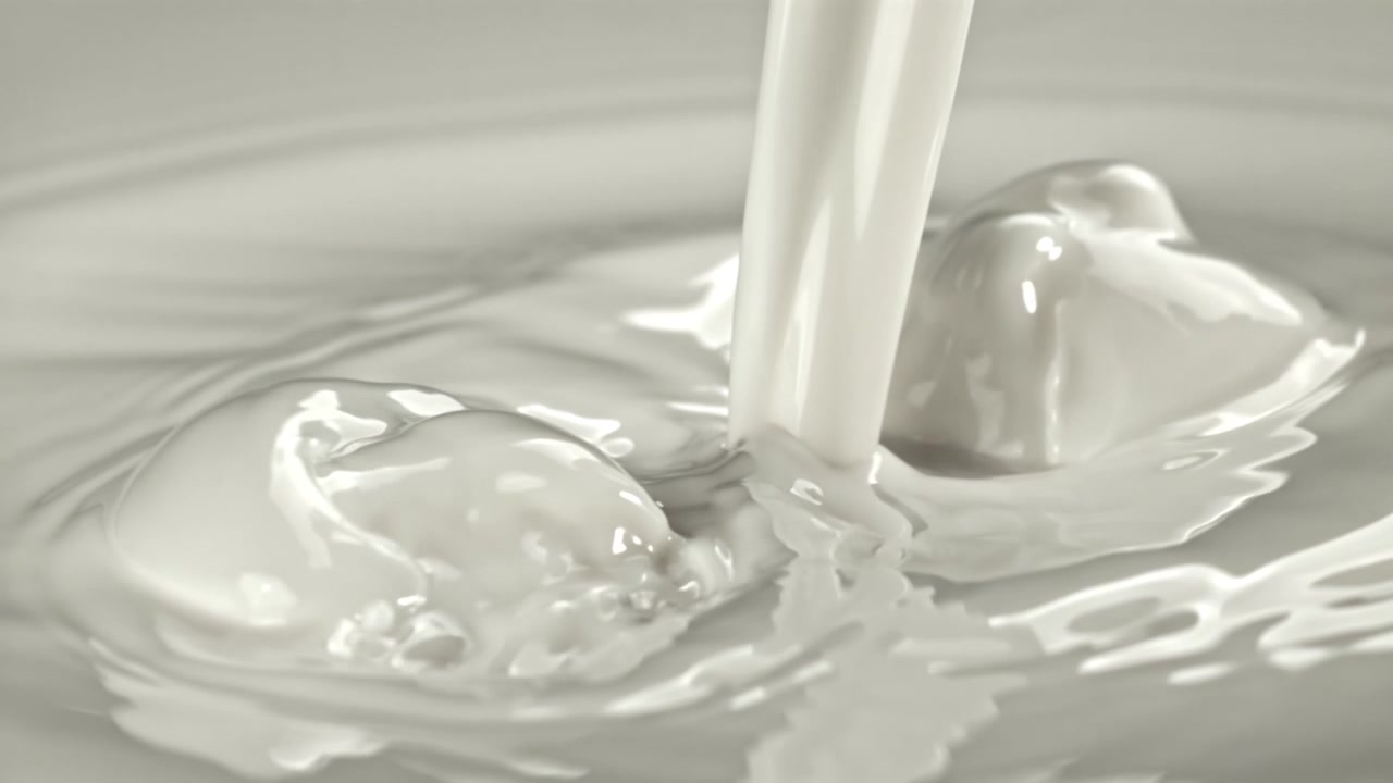 Slow Motion Pouring of Fresh White Milk with Splashes