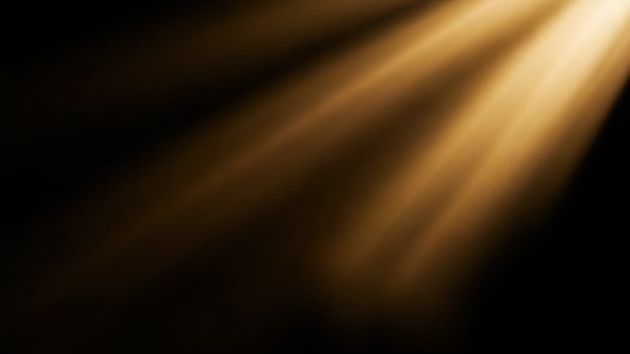 Fading darkness unveiling golden light beam casting diagonal rays illuminating void, copy space