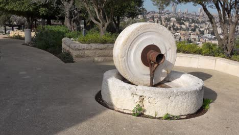 replica of an ancient olive press called a mola olearia made of millstones to grind olives into oil