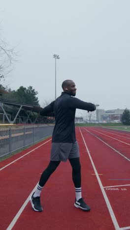 man warming up on a track