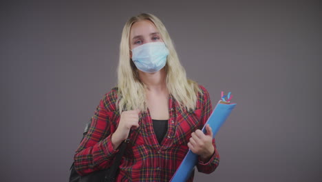 Young-Blonde-Female-Student-Wearing-Face-Mask