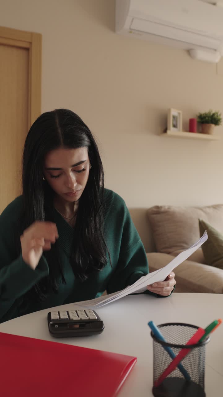 Woman stressed about bills at home