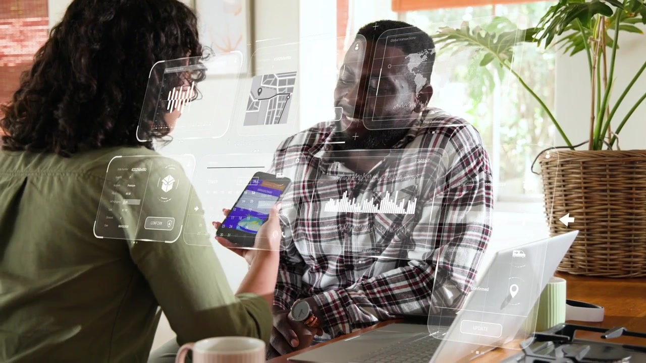 Woman showing phone and tapping, man shifting while AR HUD highlighting app for review on laptop