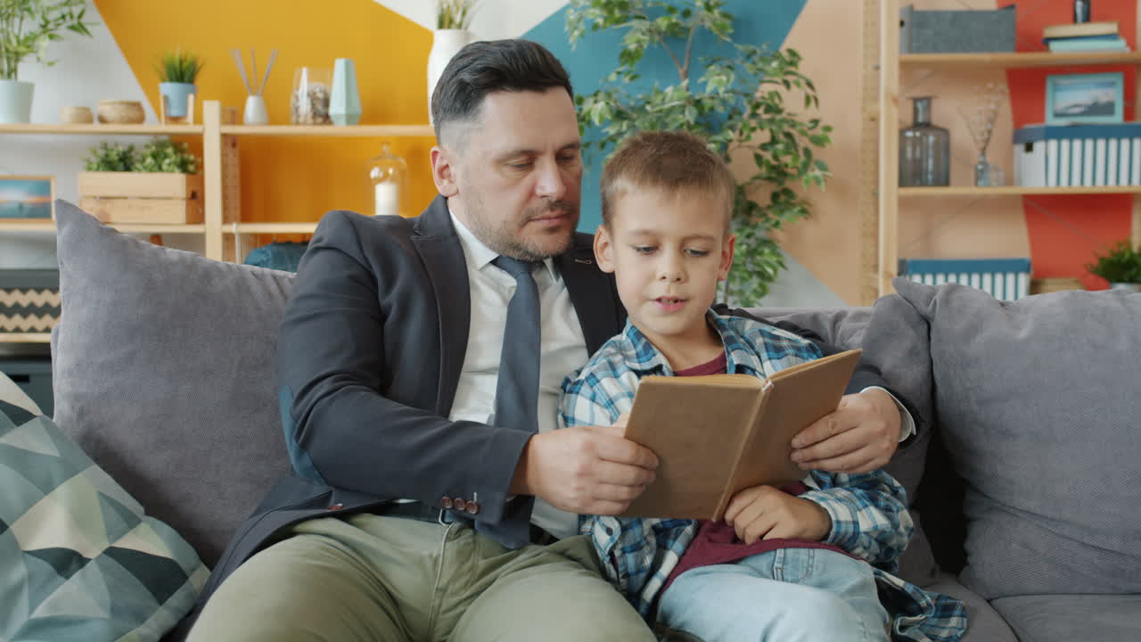 Father and Son Reading Together at Home