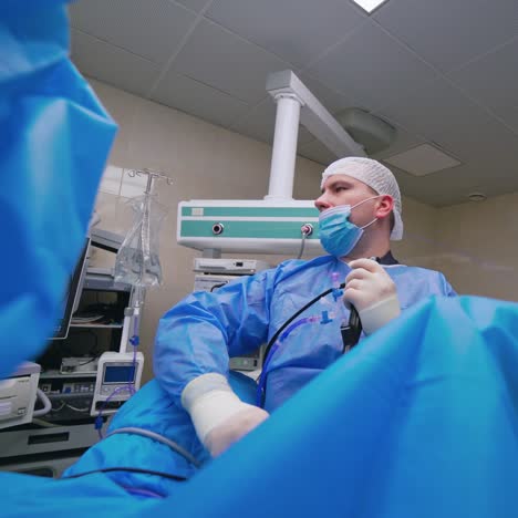 medical procedure in emergency room. surgical team performing surgery in modern operation theater