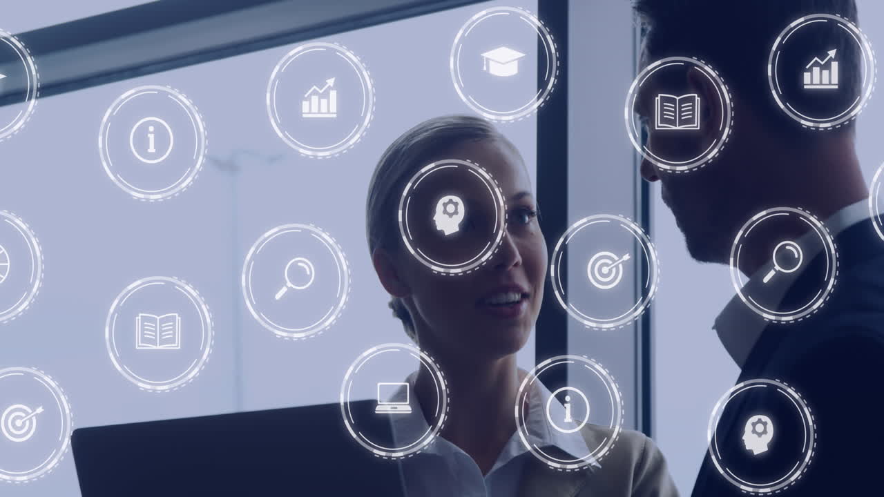 Animation of multiple icons over diverse coworkers discussing report on laptop in office