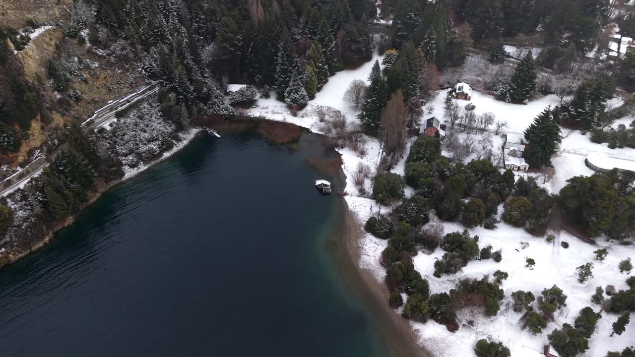 Snowy aerial view about Perito Moreno Lake at suburban side of Colonia Suiza in winter atmosphere, Bariloche, Argentina