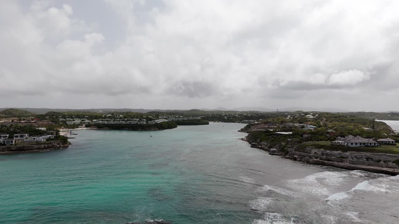 Rocky Coastal Landscape Of Devil's Bridge Under Cloudy Sky In Eastern Antigua. aerial, sideways shot