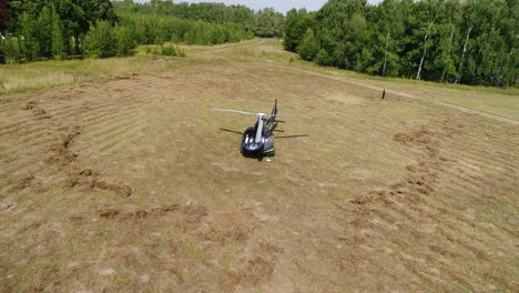 helicopter landing in a field