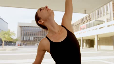 ballet dancer dancing by railing on pavement 4k