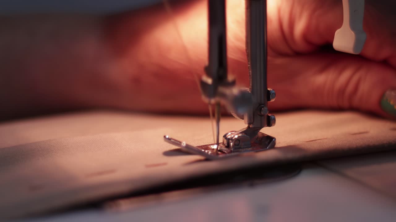 4K Closeup of a machine sewing a piece of clothing