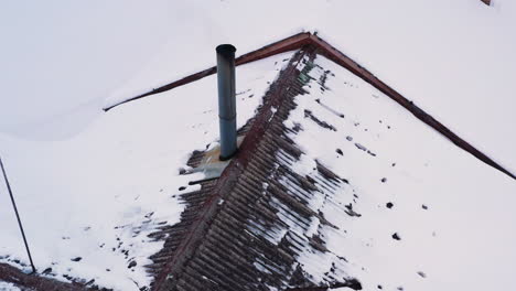 smokes come out of tin chimney on winter heating season, aerial circle