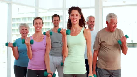 fitness group lifting hand weights