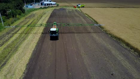 self-propelled sprayer on farm. vinnitsa, ukraine - july 2017: self-propelled sprayer irrigating crops on agriculture farm
