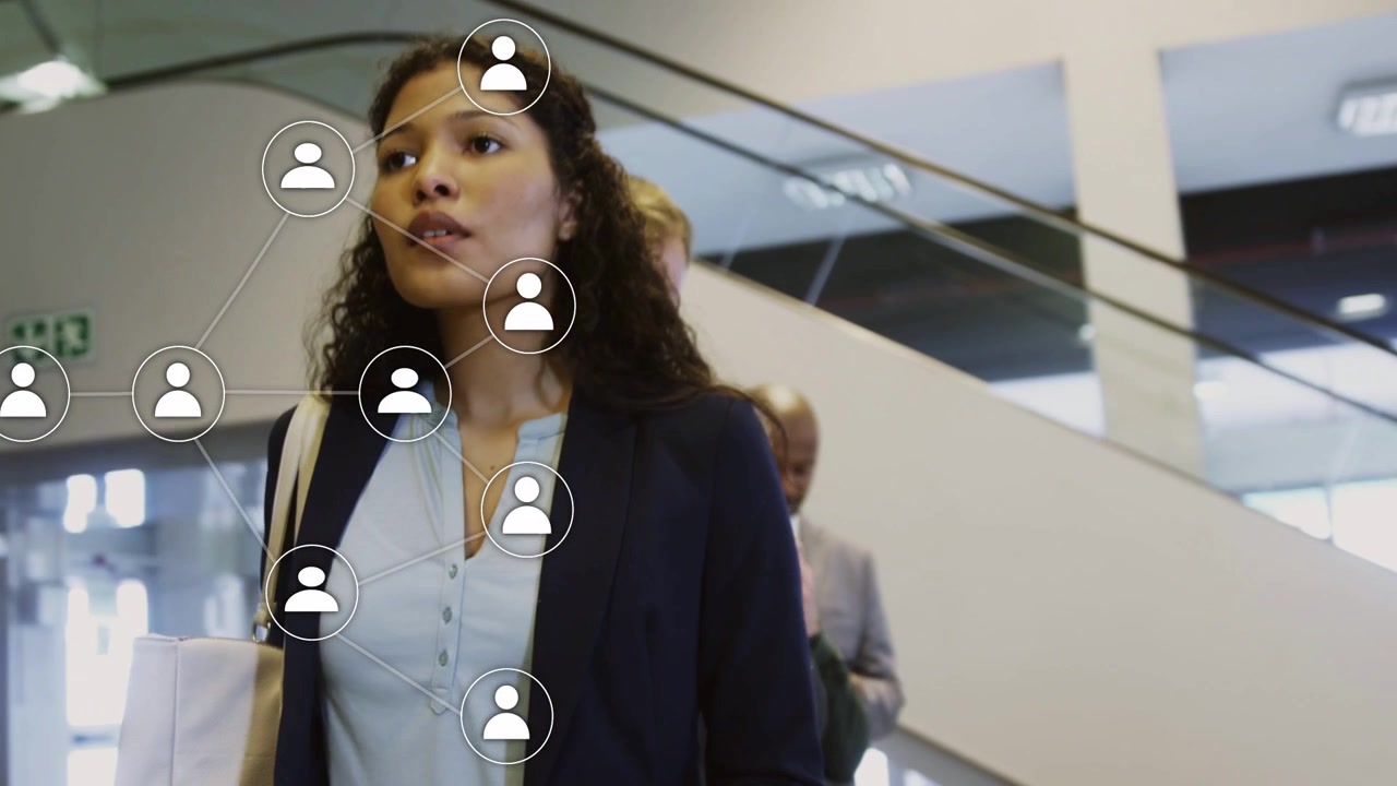 Younger woman walking escalator, initiating network overlay connecting phones for business