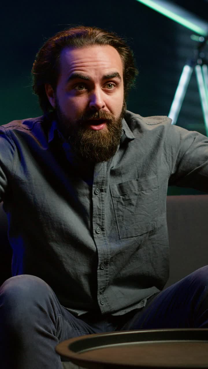 Vertical video Annoyed supporter watching sports broadcast, howling at awful team mistake